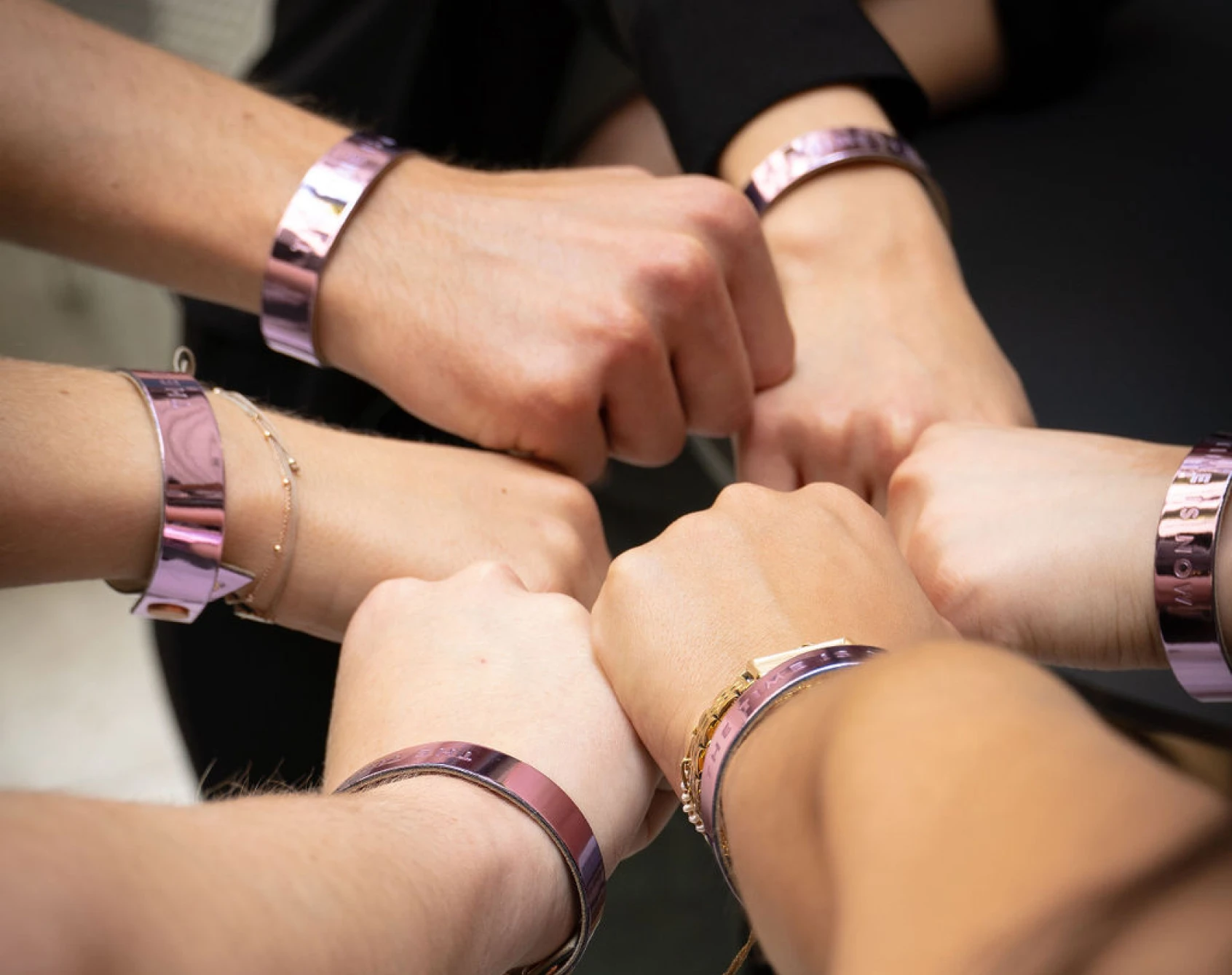 Event wristbands with a printed message in metallic purple